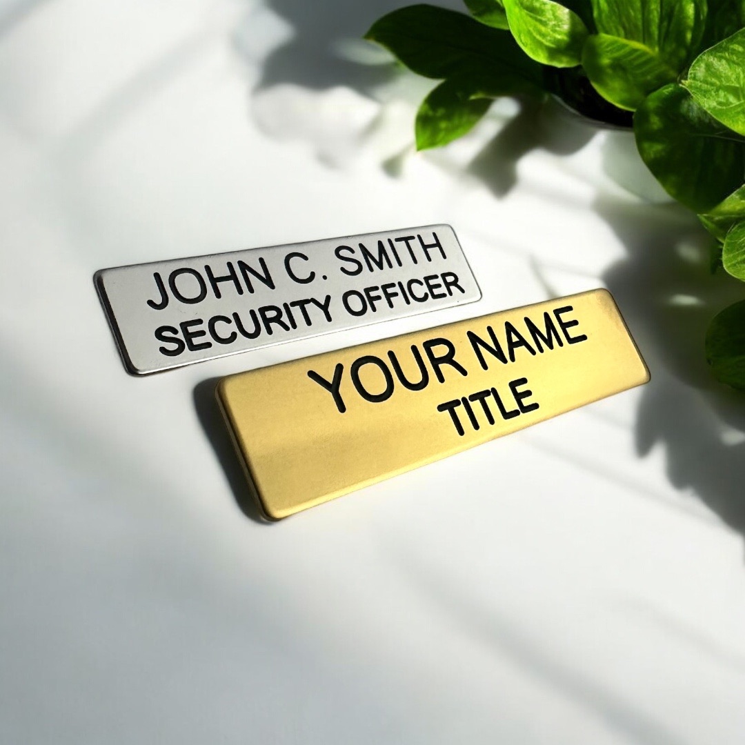 High-quality name badges are displayed on a clean background, showing different colors and styles for professional use